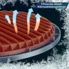 A close-up view of a metal heat sink with arrows indicating heat dissipation, set against a dark background with frost effects. Produktbild-Vorschau