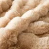 A close-up view of a soft, plush blanket with a textured, rippled surface. Náhled obrázku produktu
