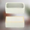 Two views of a rectangular ceramic planter, one from the top showing the interior and one from the bottom showing the base with small feet. Produktbild-Vorschau