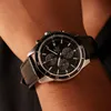 A close-up shot of a man's wrist wearing a black Casio Edifice watch. Produktbild-Vorschau