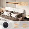 A bedroom scene with a bed and headboard featuring storage and a charging station. Produktbild-Vorschau