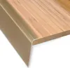 A close-up view of a stair nosing profile attached to a wooden surface. Podgląd zdjęcia produktu