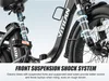 Close-up of the front suspension and seat post of an electric bike, with text overlays highlighting the suspension system. Produktbild-Vorschau