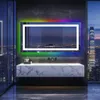 A modern bathroom with a large LED mirror reflecting a city skyline at night. Produktbild-Vorschau