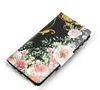A flip cover phone case with a floral and ornate design is shown at an angle against a white background. Produktbild-Vorschau