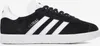 A side view of a black Adidas Gazelle sneaker with white stripes and a white sole. Produktbild-Vorschau
