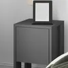 A close-up of a modern anthracite nightstand with an e-reader on top. Anteprima dell’immagine prodotto