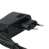A close-up of a black power adapter with a European plug. Produktbild-Vorschau