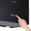 A hand is shown pressing a button on a black kitchen hood. Náhľad obrázku produktu