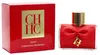 Rotes CH HC Privée Parfum von Carolina Herrera mit goldener Kappe, roter Schleife und Logo-Anhänger vor passender Verpackung. Produktbild-Vorschau