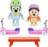 A set of Bluey toys including two figures, two scooters, and a bench. Náhled obrázku produktu