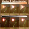 Collage showing a flower-shaped desk lamp with different lighting colors and brightness levels. Produktbild-Vorschau