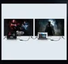 Two laptops connected to two large TVs, displaying different content. Voir les images du produit