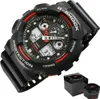 A black G-Shock watch with red accents is shown on a white background, with its packaging in the lower right corner. Náhľad obrázku produktu