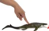 A hand is pressing on the back of a toy Mosasaurus, causing its mouth to open. Náhľad obrázku produktu