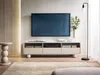 A modern living room scene featuring a TV stand with a television mounted above it, a floor lamp, and decorative items. Produktbild-Vorschau
