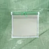 A close-up view of a green greenhouse with a mesh window. Anteprima dell’immagine prodotto