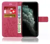 A pink flip case for a smartphone, showing credit cards and euro banknotes inserted into the case. Produktbild-Vorschau