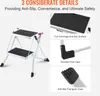 A product image showcasing a two-step folding ladder with close-up views of its anti-slip features. Voir les images du produit