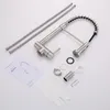 A disassembled kitchen faucet and its components are laid out on a white surface. Podgląd zdjęcia produktu