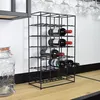 A black metal wine rack filled with wine bottles, placed on a wooden surface next to a glass dispenser. Produktbild-Vorschau