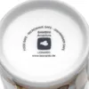 The bottom of a white mug with text and a logo printed on it. Produktbild-Vorschau