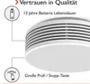 A close-up of a white smoke detector with text overlays highlighting its features. Produktbild-Vorschau