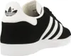 A side view of a black Adidas Gazelle sneaker with white stripes and sole. Produktbild-Vorschau