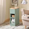 A small green side table with wooden top next to a chair. Náhľad obrázku produktu