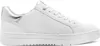 A white women's sneaker with a textured side panel and silver accents on the heel and tongue. Náhľad obrázku produktu