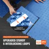 A person is shown installing blue interlocking floor tiles. Podgląd zdjęcia produktu