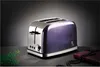 A stylish purple and silver toaster is displayed on a dark surface with a dark background. Produktbild-Vorschau