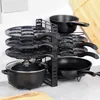 A kitchen organizer holding various pots and pans. Anteprima dell’immagine prodotto