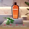 A bottle of Tabac Original shower gel is displayed on a marble pedestal in a bathroom setting. Podgląd zdjęcia produktu
