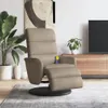 A massage chair with a footrest is shown in a living room setting, next to a plant and a TV stand. Náhľad obrázku produktu