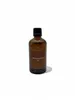 A brown glass bottle of cleaning oil with a black cap, set against a plain white background. Produktbild-Vorschau