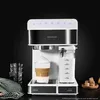 A coffee machine with a latte in a glass next to it and a jug of milk. Podgląd zdjęcia produktu