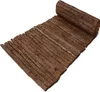A rolled-up mat made of bark pieces, displayed on a white background. Anteprima dell’immagine prodotto