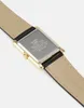 The back of a gold-toned watch with a leather strap. Produktbild-Vorschau