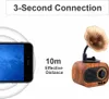 A smartphone is shown on the left, with a retro-style Bluetooth speaker on the right. Text indicates a 10m effective distance. Produktbild-Vorschau