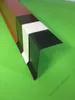 Several pieces of metal flashing for a flat roof are displayed in different colors on a green surface. Produktbild-Vorschau