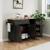 A kitchen cart with a wooden countertop and black cabinets, featuring open doors and shelves stocked with various items. Náhled obrázku produktu