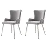 Two gray velvet dining chairs with silver metal legs are shown against a white background. Podgląd zdjęcia produktu