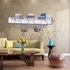 A living room scene with hexagonal mirror wall stickers as decoration. Produktbild-Vorschau
