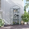 A greenhouse with shelves filled with plants is placed on a wooden deck next to a white-paneled wall. White roses are in the foreground. Voir les images du produit