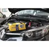 A car battery charger is connected to a car battery under the hood of a car. Anteprima dell’immagine prodotto