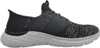 A side view of a black and gray Skechers slip-on shoe with a white sole. Anteprima dell’immagine prodotto