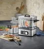 A kitchen counter with a sous vide cooker, food, and cooking utensils. Produktbild-Vorschau