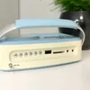 Close-up of the side of a retro-style radio, showing buttons and ports. Produktbild-Vorschau