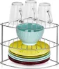 A corner shelf unit holding glasses, a bowl, and plates. Anteprima dell’immagine prodotto